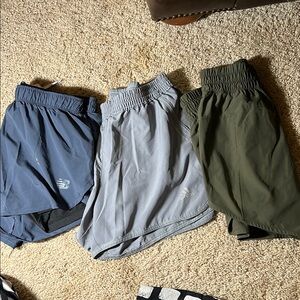 3 pairs of athletic shorts; new balance, adidas and avia.
